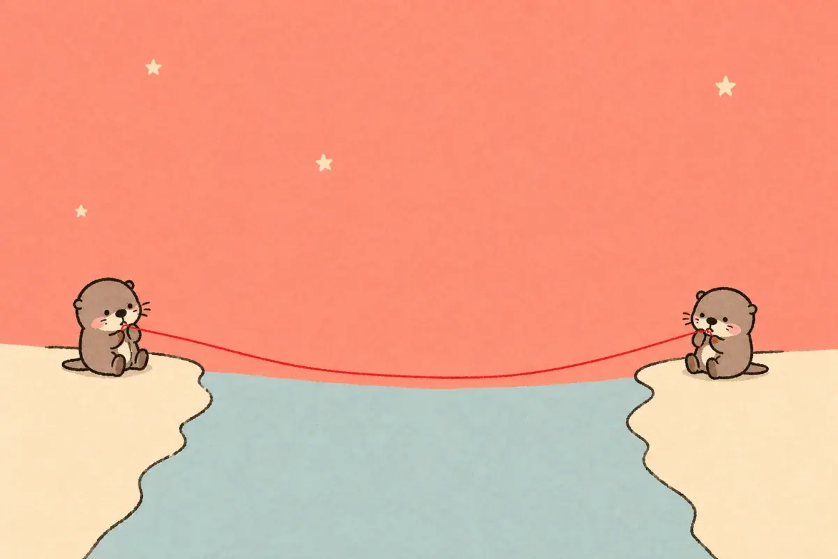 Two small Moyu otters sitting on opposite banks of a pale blue river and holding the ends of one red thread